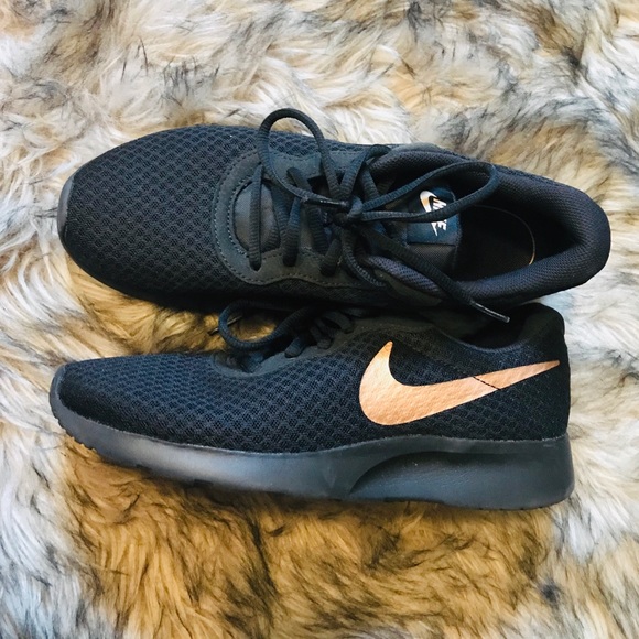 black nike with rose gold swoosh